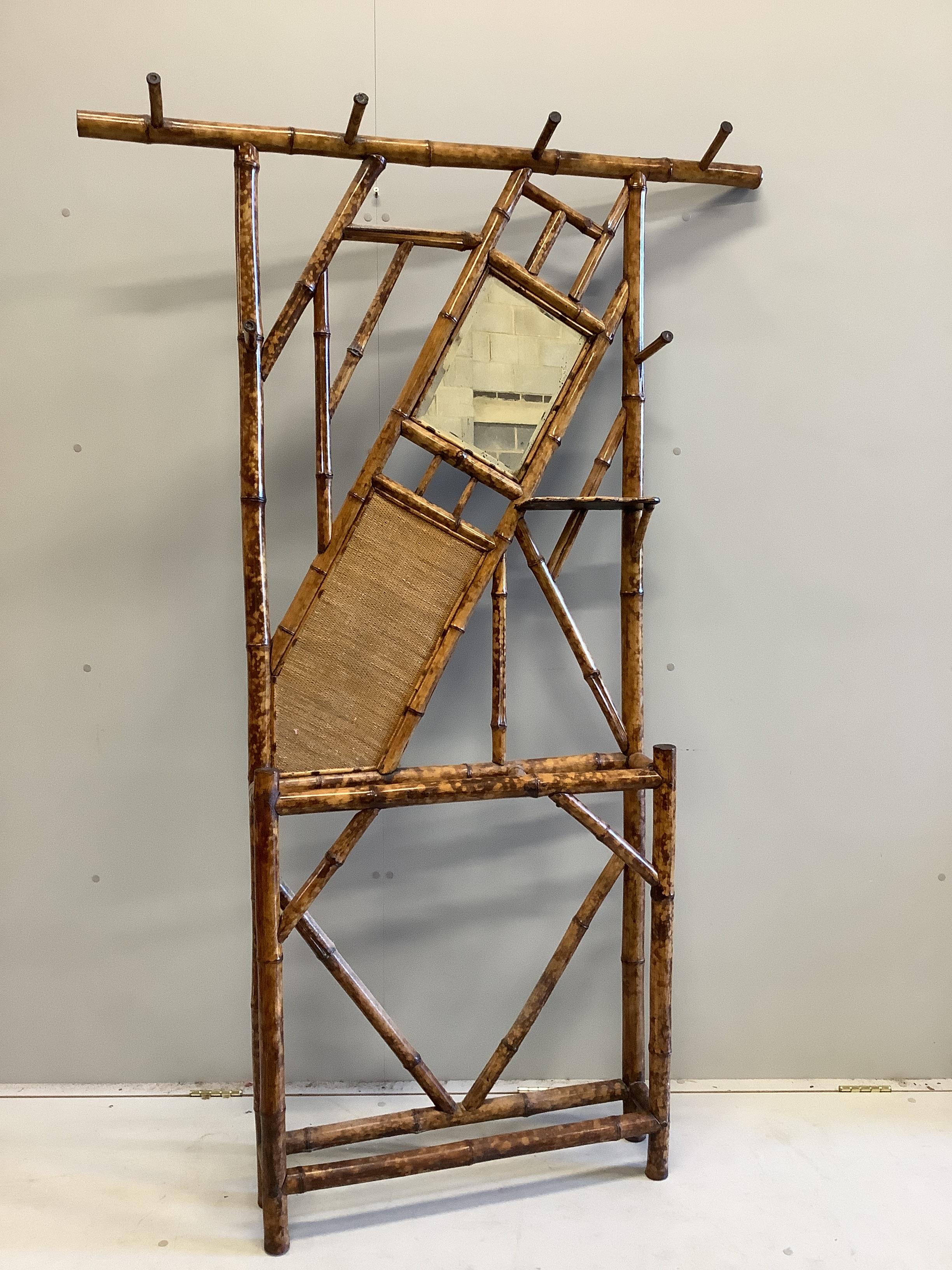 Two late Victorian bamboo hallstands and a bamboo wall mirror, largest width 120cm, height 186cm